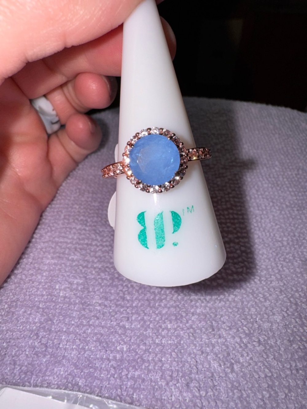 bp Rose Gold Ring with Blue Center Stone and Halo